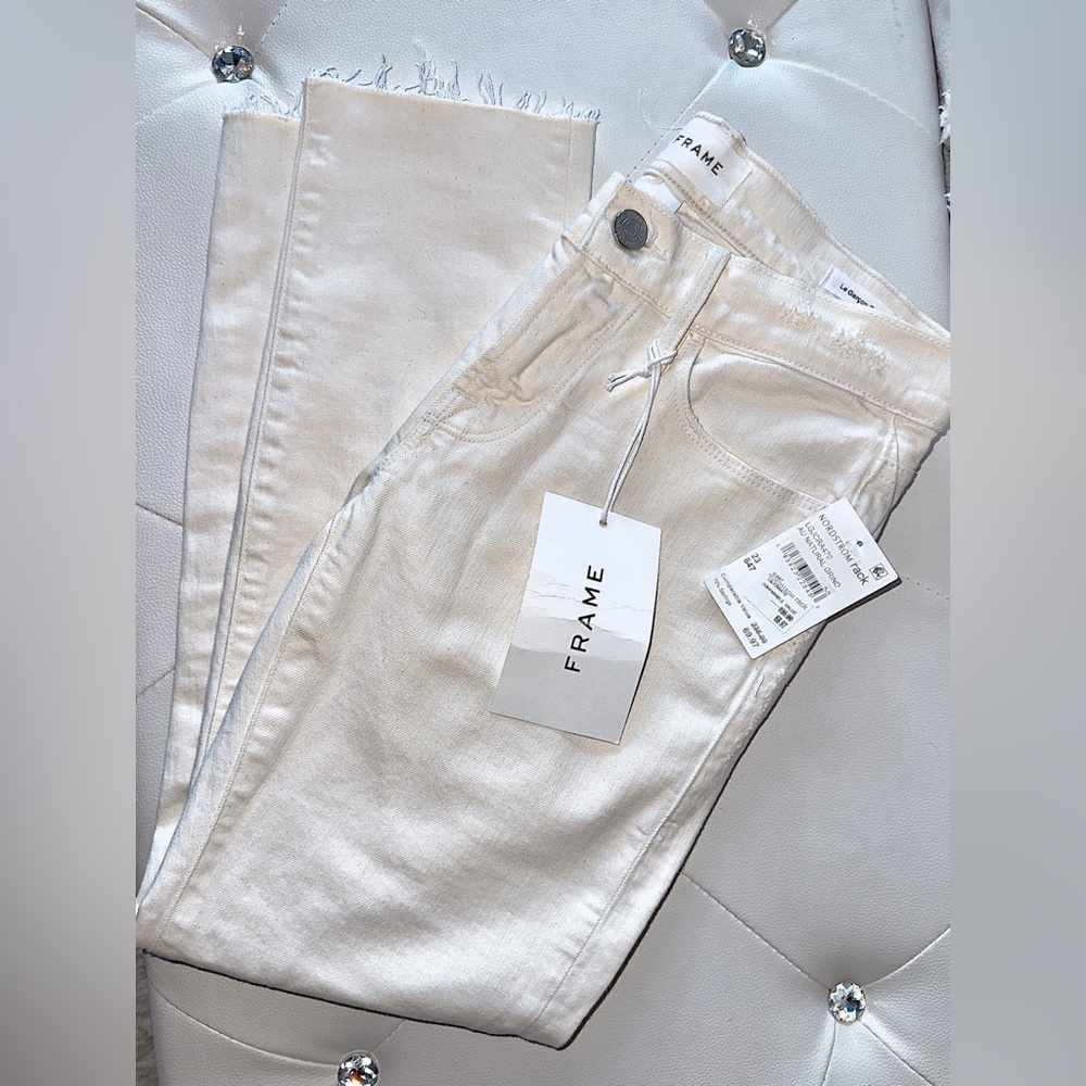 A pair of off white/cream colored cropped Frame denim.